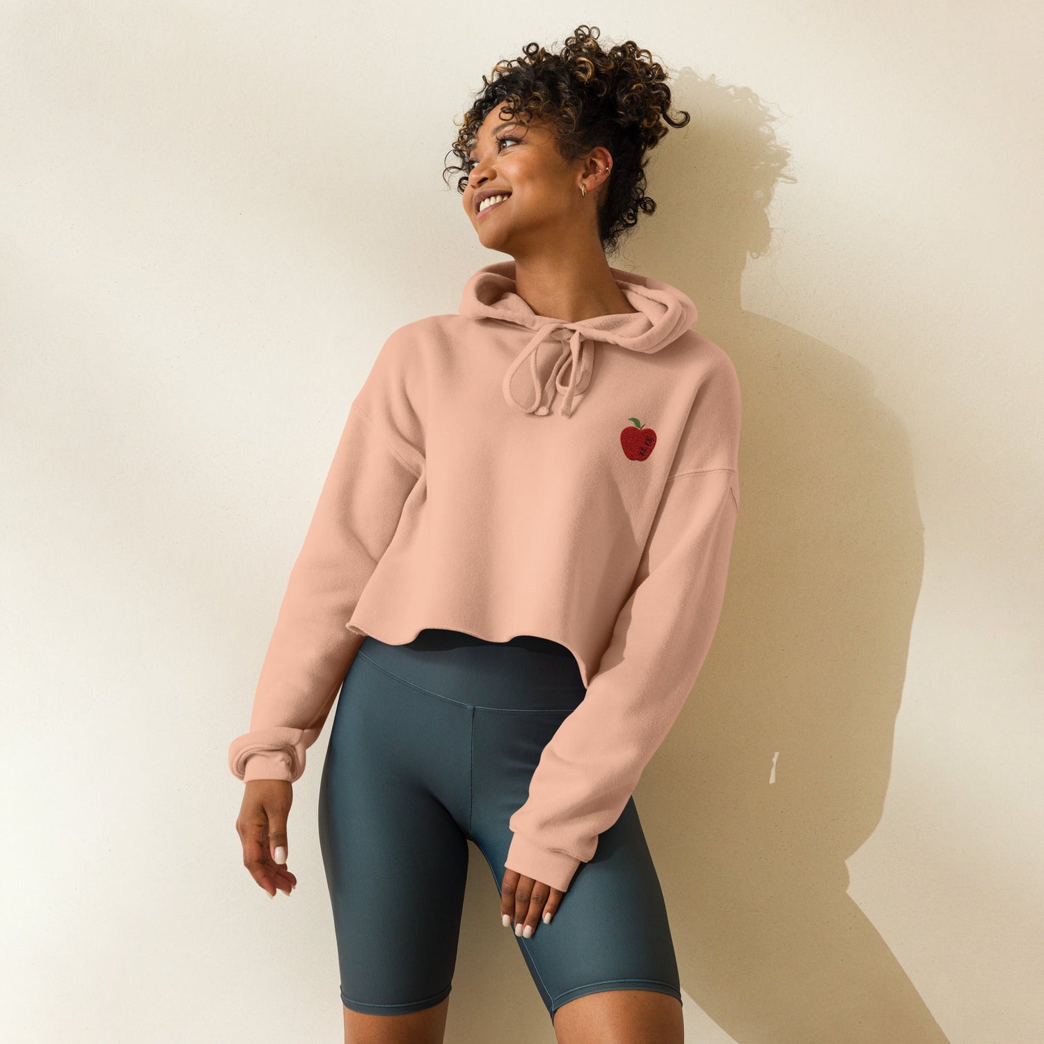 a woman is wearing a hoodie with a Japanese letter